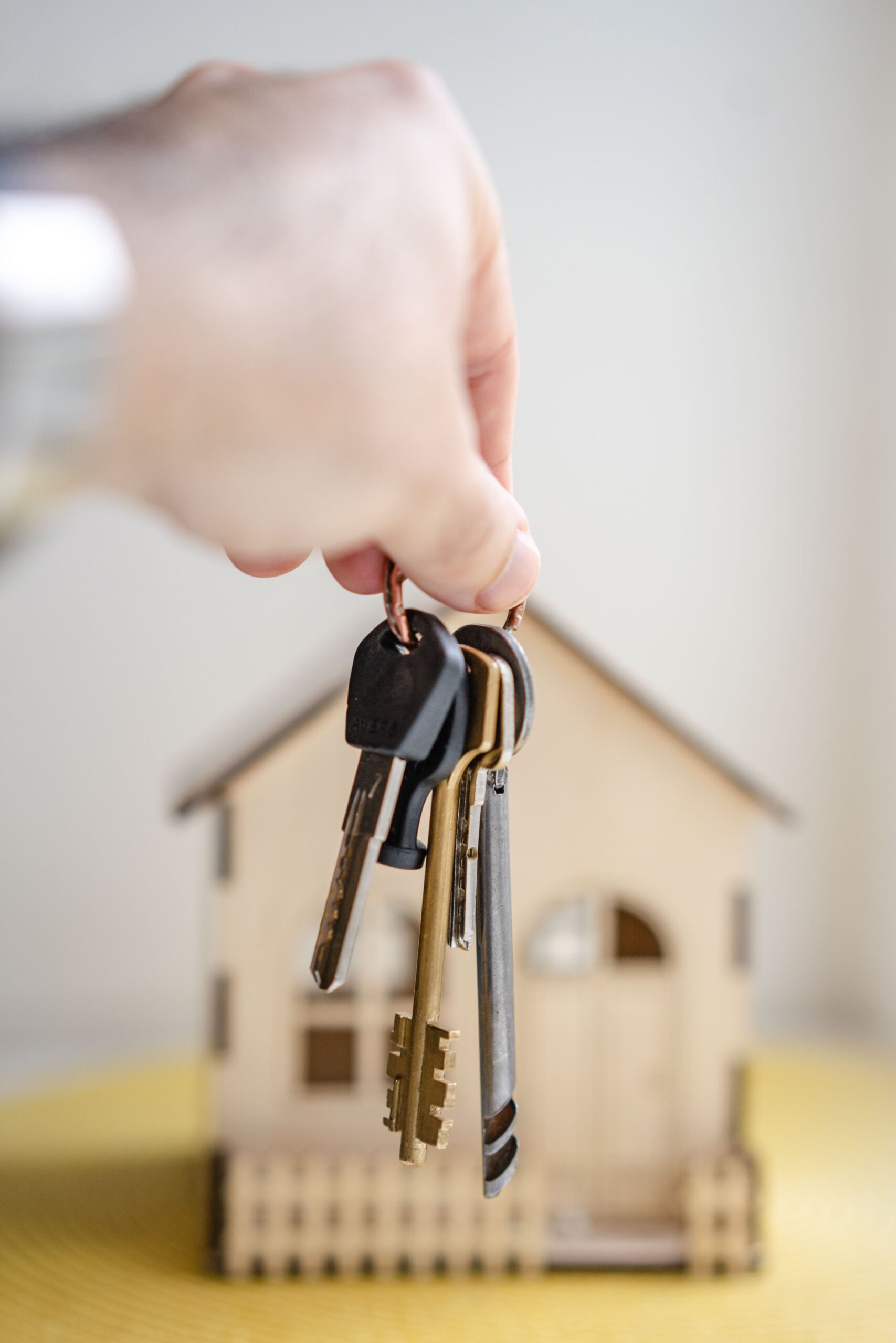 Hand holding house keys